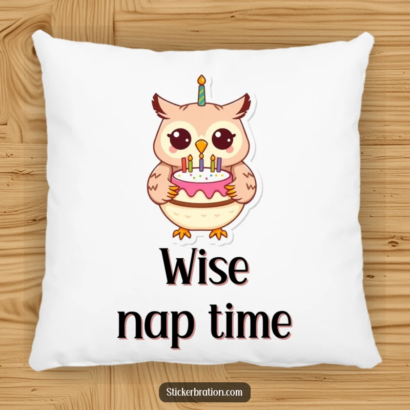 Funny cheerful owl character holding a birthday cake, resting on a soft and decorative pillow.