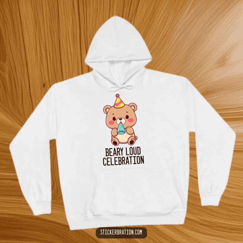 Funny hoodie showcasing a cute bear character wearing a party hat and blowing a noisemaker, embodying festive cheer and comfort.
