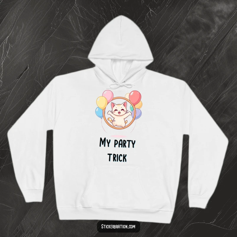 Funny cat character in a hoodie, leaping through a hoop of balloons with a joyful expression.