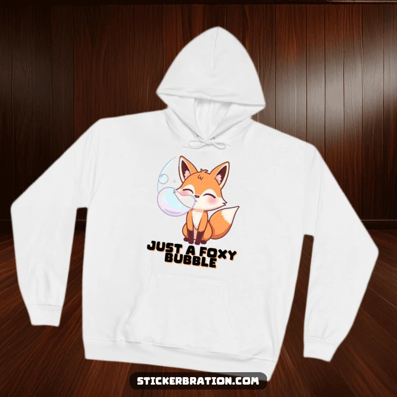 Funny bubbly fox character hoodie winking while blowing a giant bubble, ideal for cozy, playful style.
