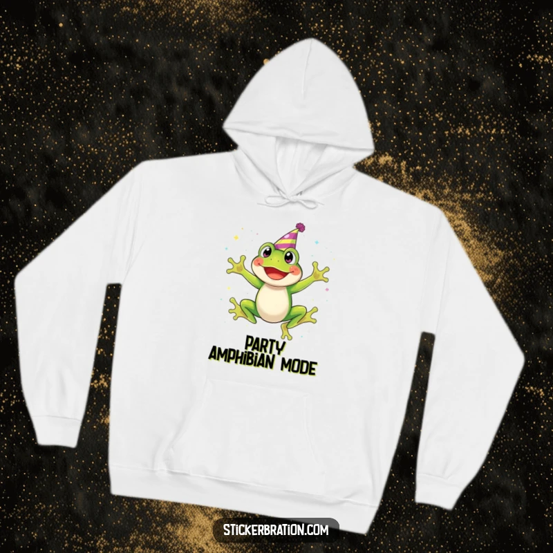 Funny hoodie featuring a happy frog in a party hat, mid-leap, with a dazzling trail of glitter falling around it.