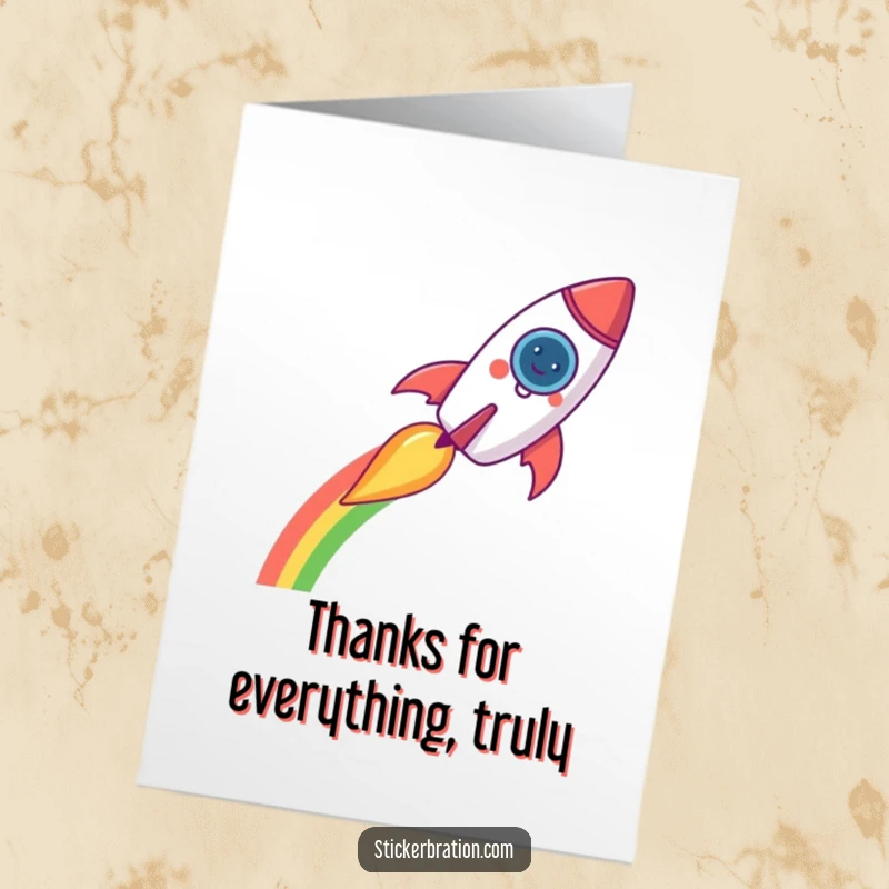 Funny Free Printable Thank You Card: A happy rocket character blasts off, leaving a colorful rainbow trail as a thank you.